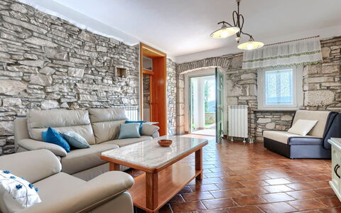 Villa Dina: Pared, Piso, Diseño De Interiores, Mueble, Suelo, Techo, Pared De Piedra, Sala, Habitación, Sofá