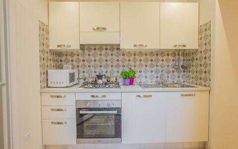 Casa Ettore: Aparato De Cocina, Cocina, Electrodoméstico, Mostrador, Gabinetes, Madera, Piso, Diseño De Interiores, Suelo, Estufa De Cocina