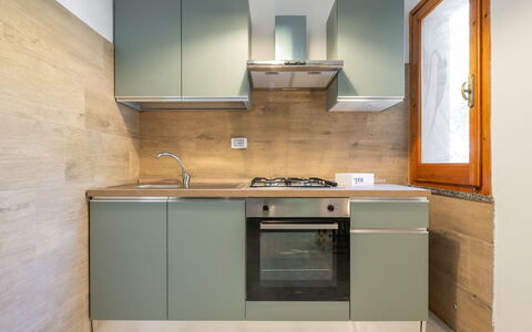 Villa sulla Roccia: Cocina, Aparato De Cocina, Electrodoméstico, Mostrador, Gabinetes, Piso, Madera, Diseño De Interiores, Electrodoméstico, Estufa De Cocina