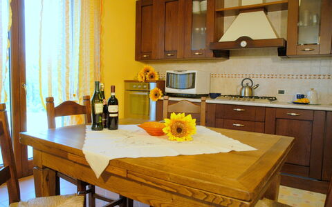 Villa Saida: Mostrador, Habitación, Mueble, Propiedad, Cocina, Amarillo, Diseño De Interiores, Suelo, Gabinetes, Edificio